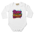 White baby onesie with 'Born Blessed' text on a white background
