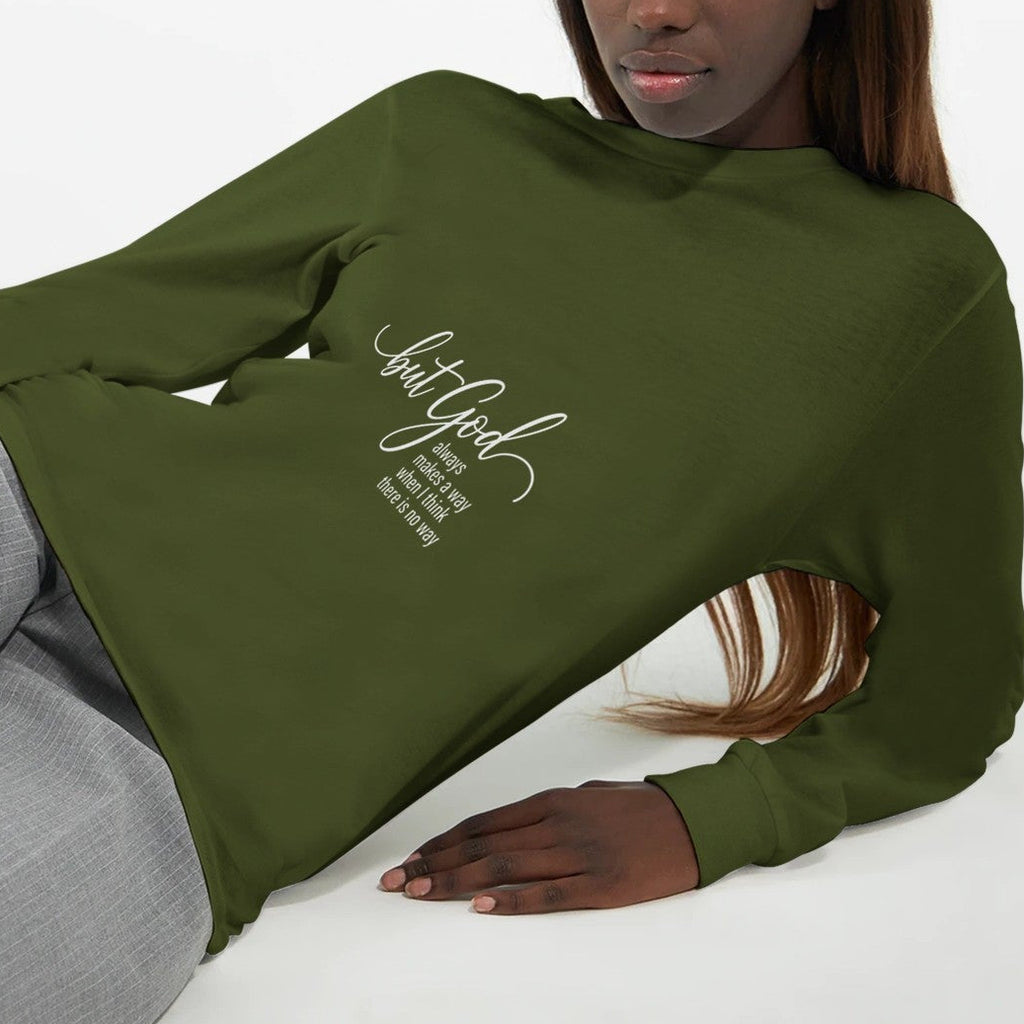 Person wearing a green sweatshirt with text on a white background