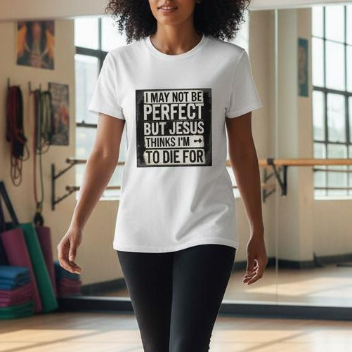 Woman walking in a dance studio wearing a white t-shirt with text.