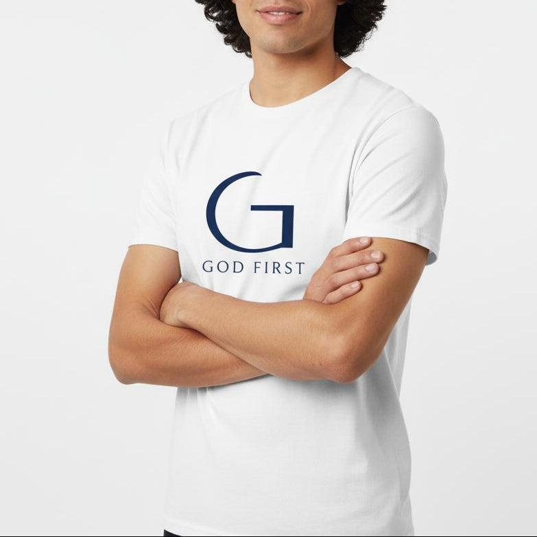 Man wearing a white t-shirt with 'GOD FIRST' logo on a light gray background