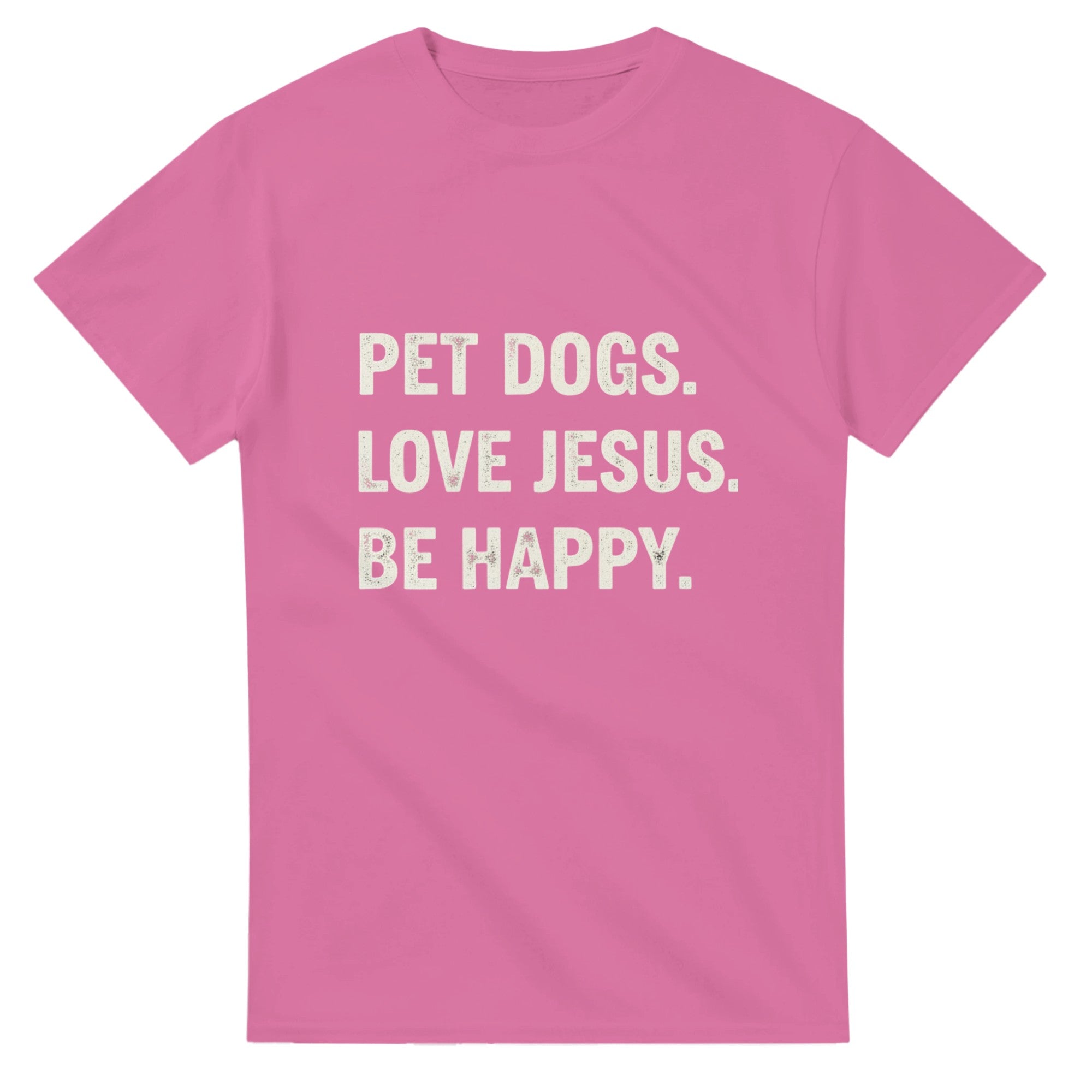 Pink t-shirt with white text 'PET DOGS. LOVE JESUS. BE HAPPY.' on a white background
