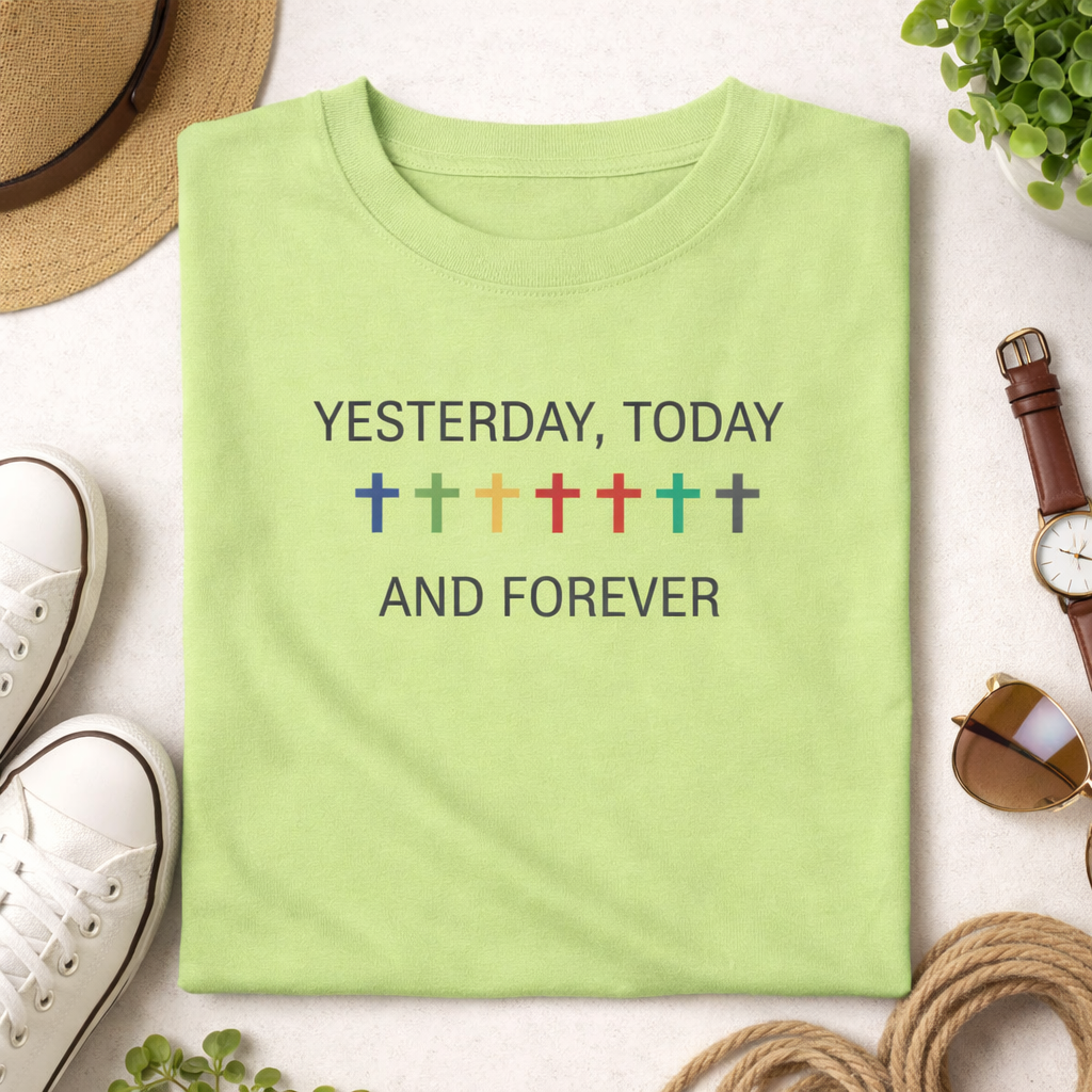 Green t-shirt with 'Yesterday, Today and Forever' text on a white surface with accessories.