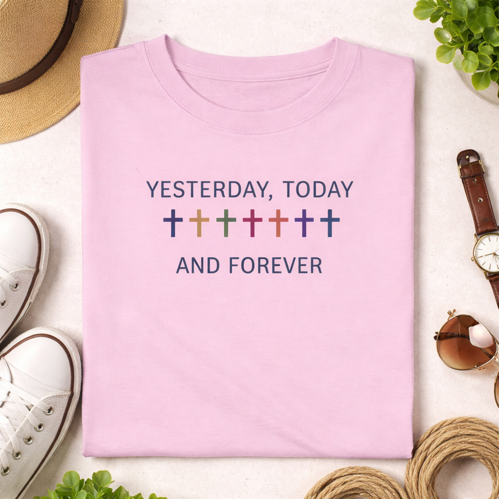 Pink t-shirt with 'Yesterday, Today and Forever' text on a white surface with accessories.
