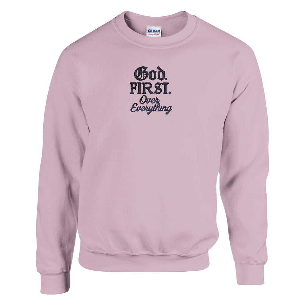 Pink sweatshirt with 'God First Over Everything' text on a white background