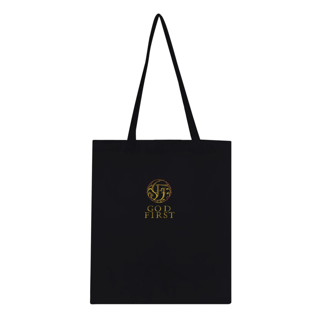 Black tote bag with gold logo and text on a white background
