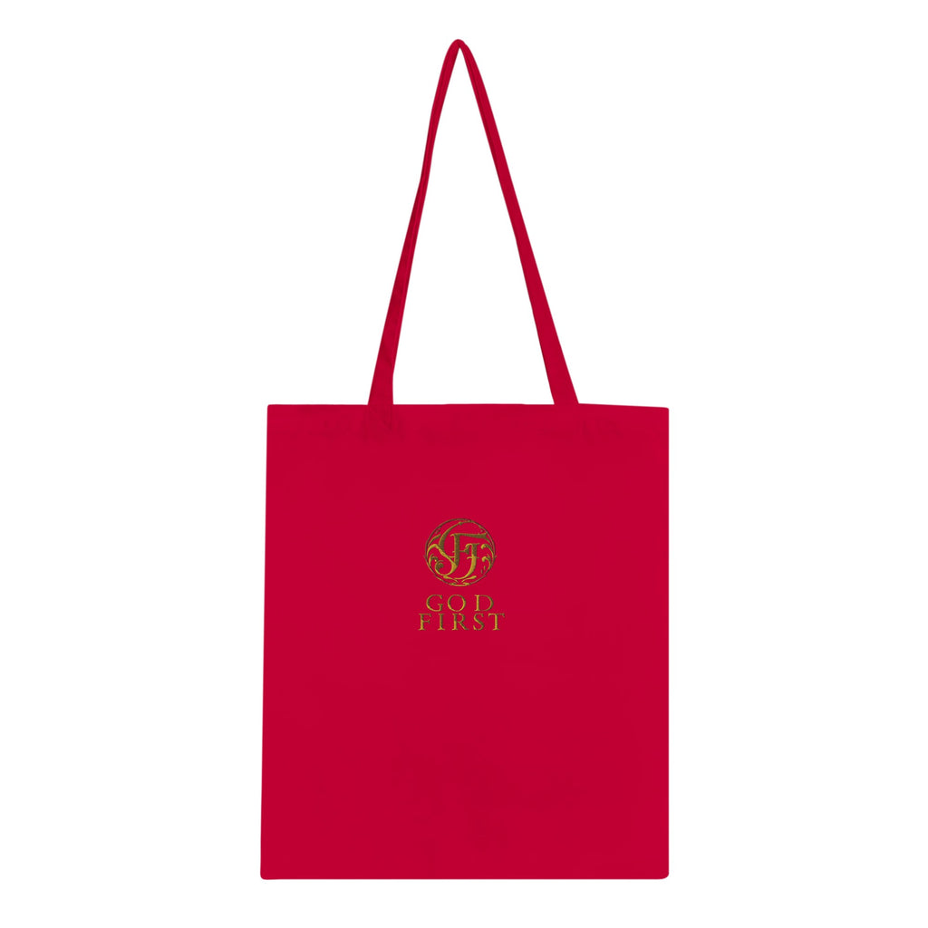 Red tote bag with a gold logo and text on a white background