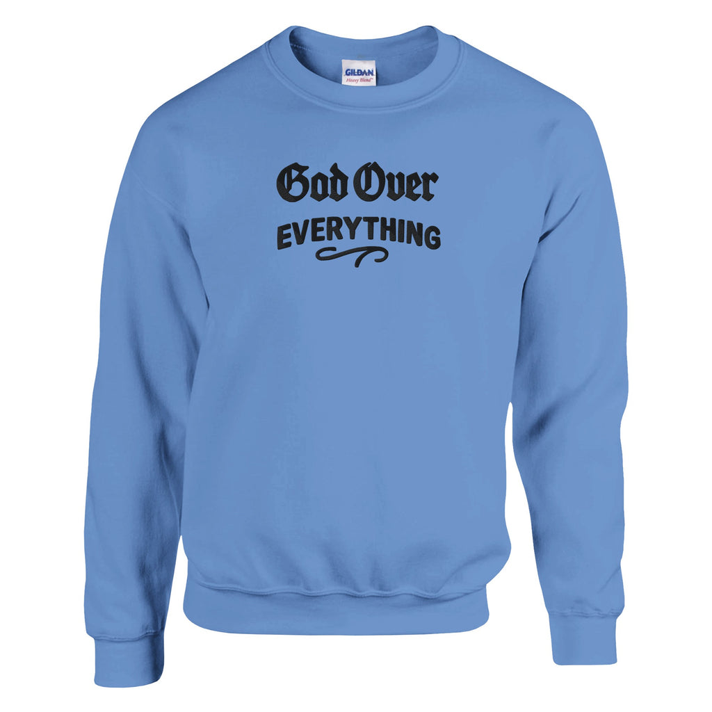 Light blue sweatshirt with 'God Over Everything' text on a white background