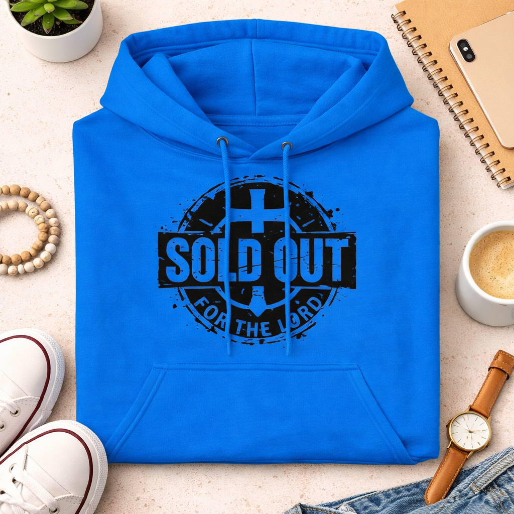 Blue hoodie with 'SOLD OUT FOR THE LORD' text on a light surface with casual items around